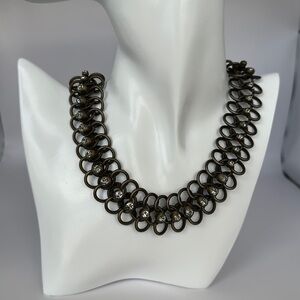 Jean Paul Gaultier bronze chain is the perfect blend